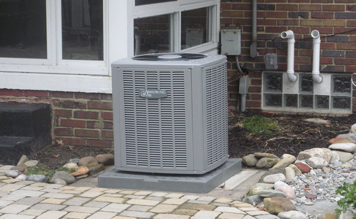 A picture of a newly installed air conditioning condenser