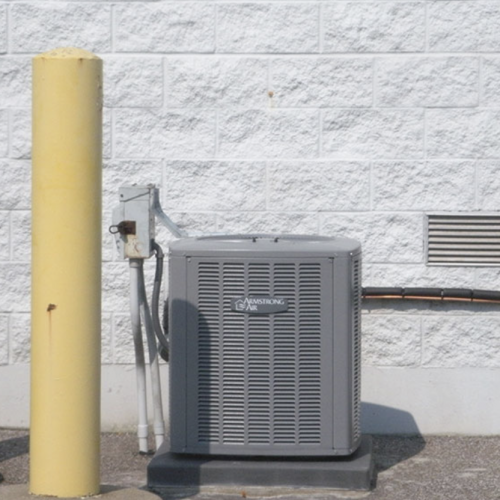 A picture of a newly installed air conditioning condenser