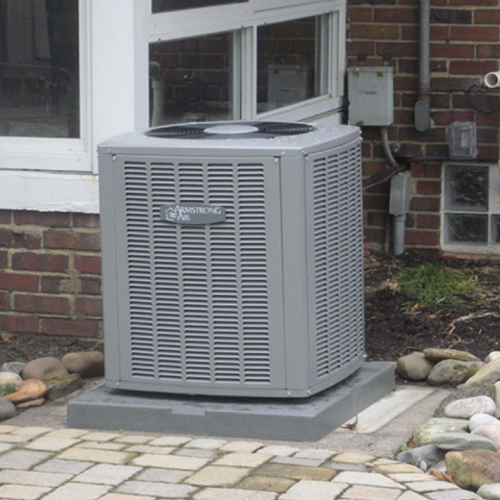 A picture of a newly installed air conditioning condenser